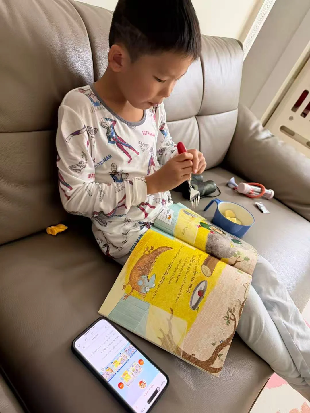 Child using Lestori at home (face blurred for privacy).